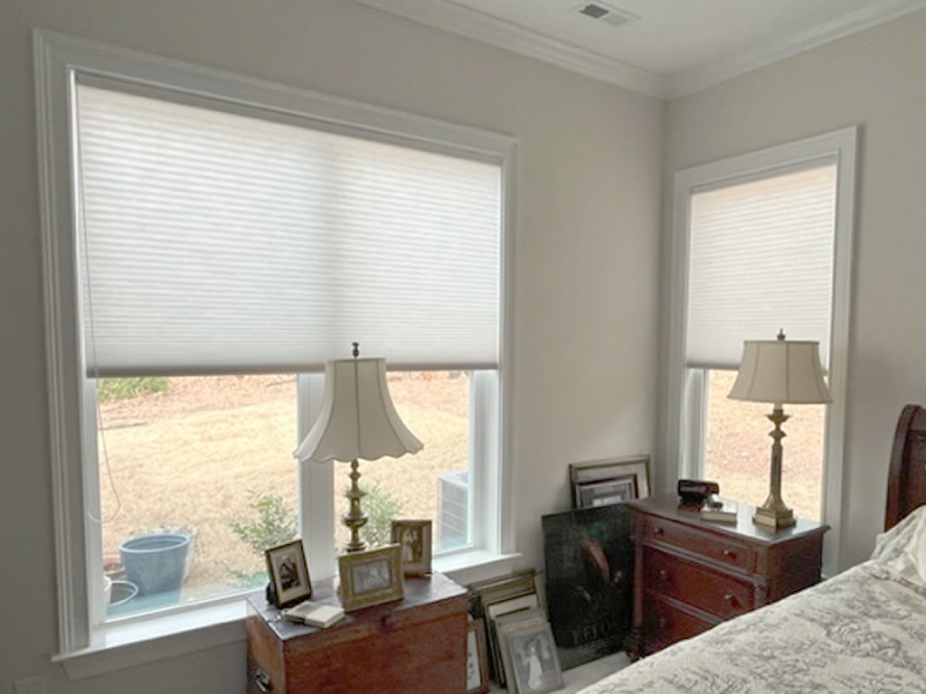 Honeycomb/Cellular Shade installed in a bedroom next to a bed