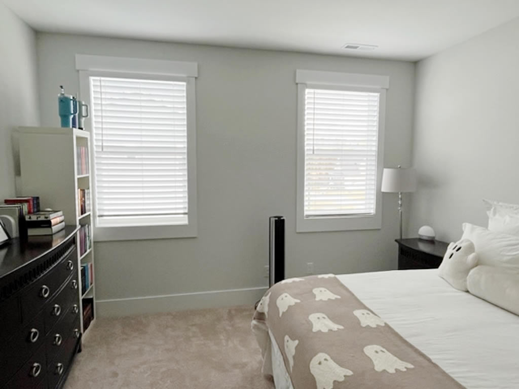 Faux Wood Shades installed in a bedroom