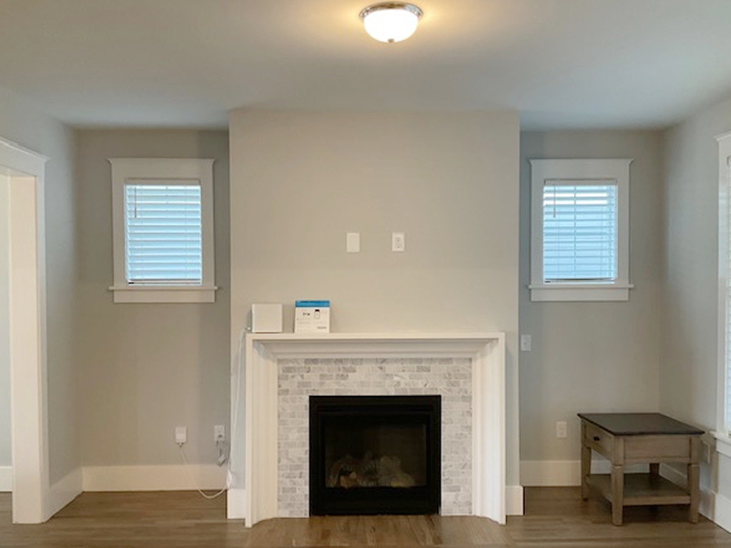 2 Faux Wood blinds installed in a living room