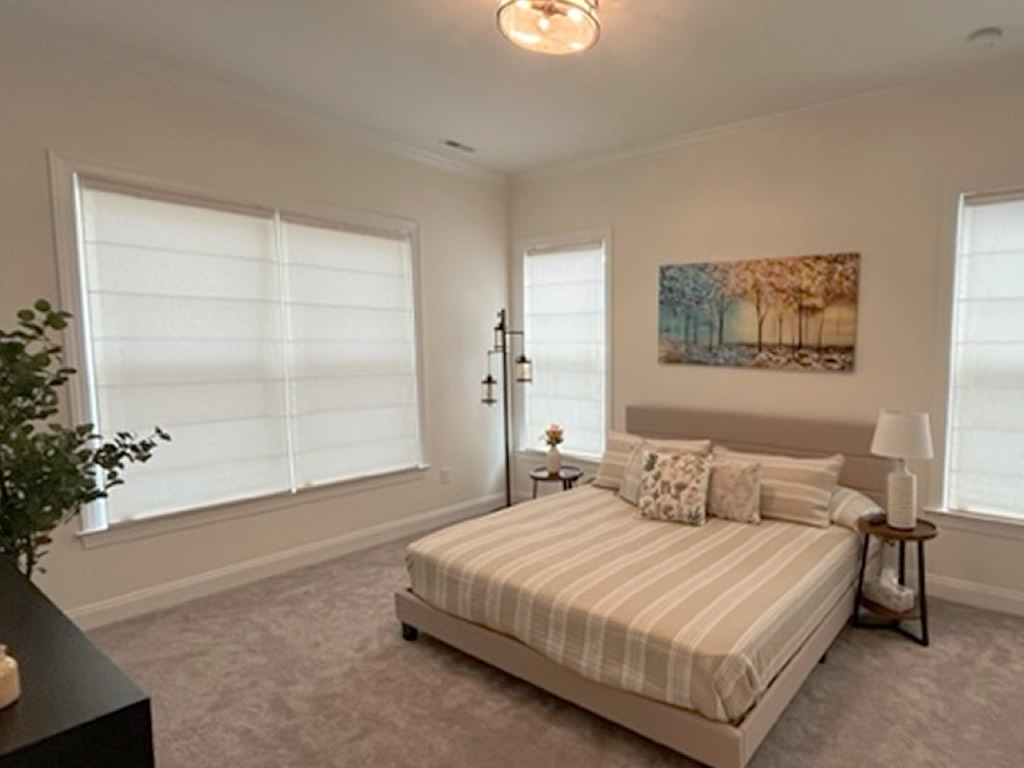 3 Roman shades installed in bedroom