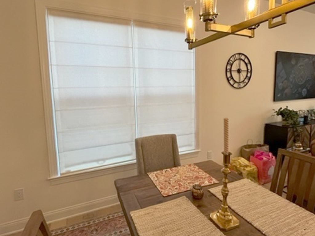 Elegant Roman Shades installed in a dining room in a home in North Carolina