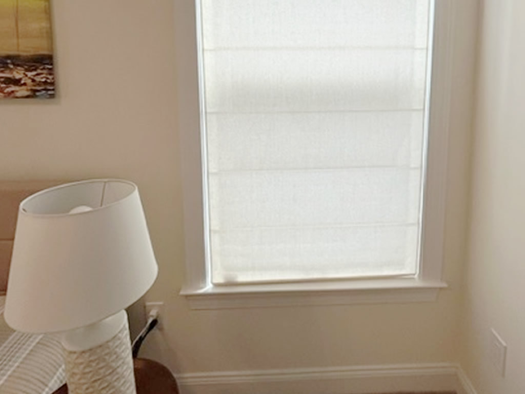 Narrow Roman Shade in a small bedroom window