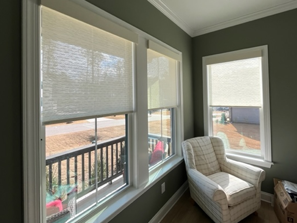 Three windows with Sheer Shades in a sitting room