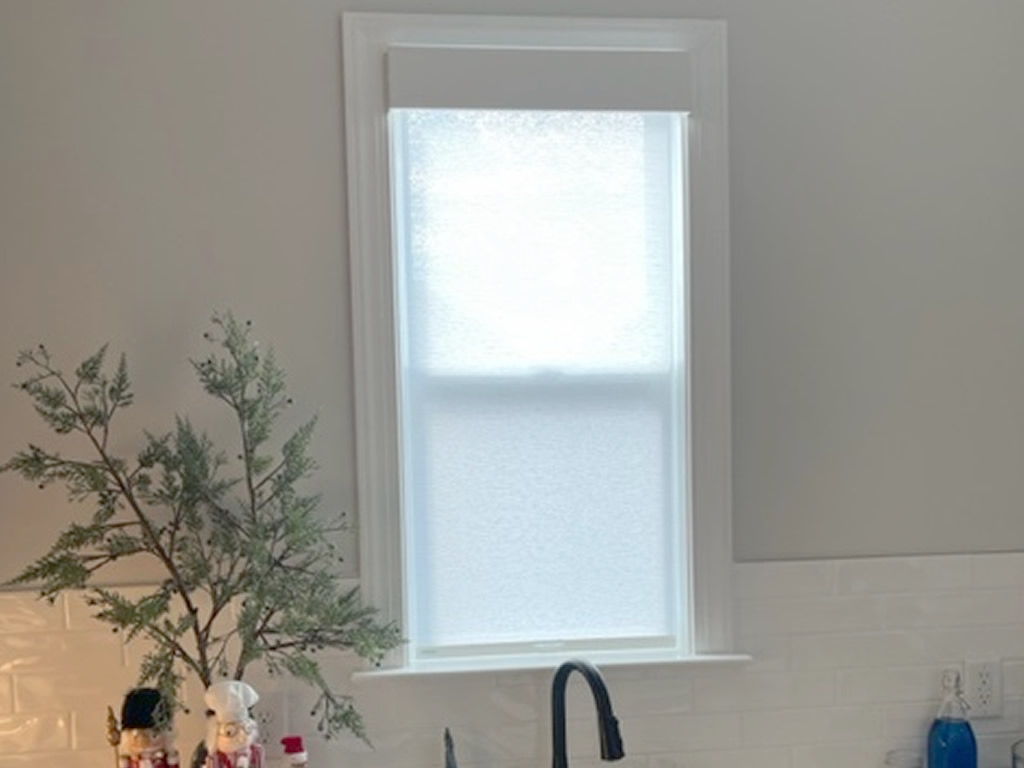 A Sheer Shade installed on a small house window